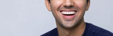 Woman smiles during a dental checkup